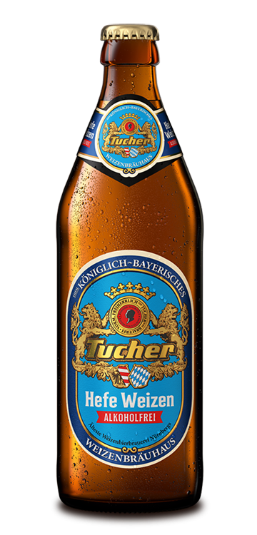 A bottle of non-alcoholic wheat beer stands upright, covered with condensed water.